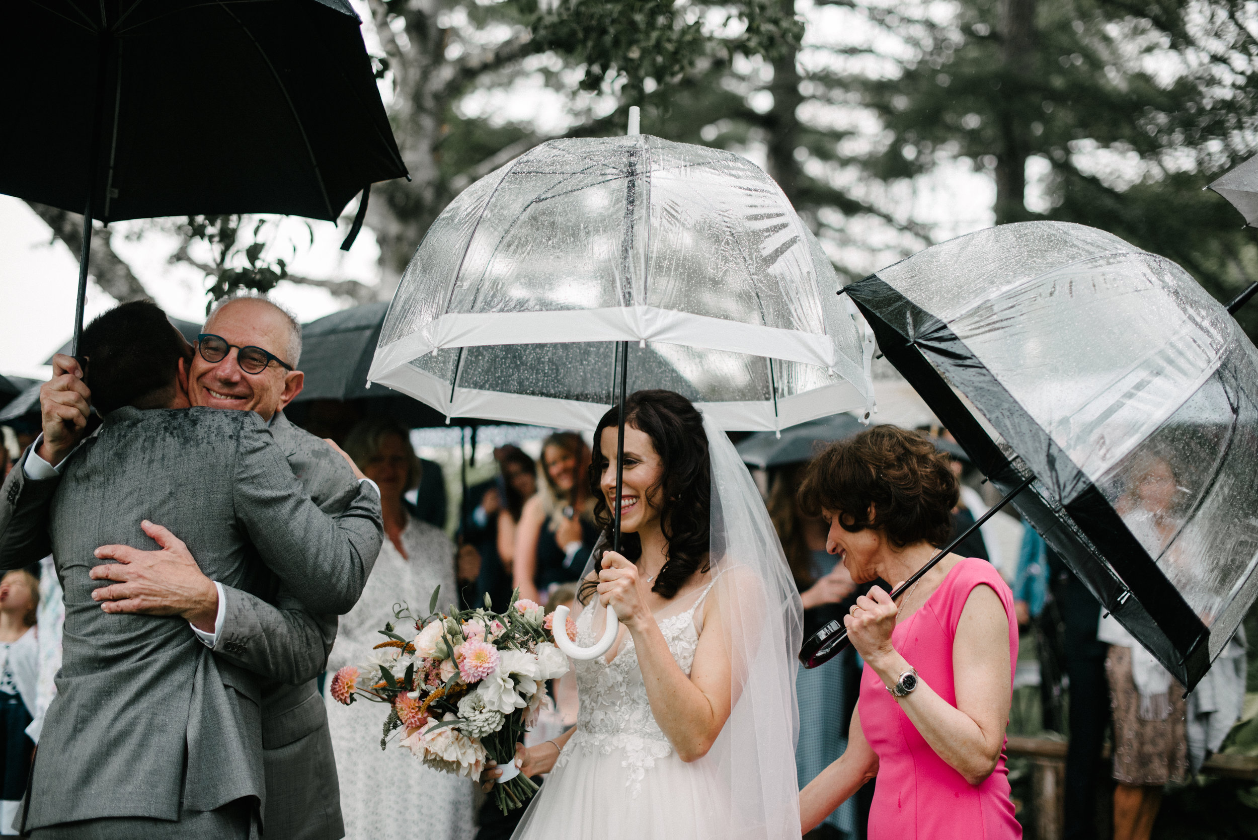 raining wedding day guests wedding photography.jpg