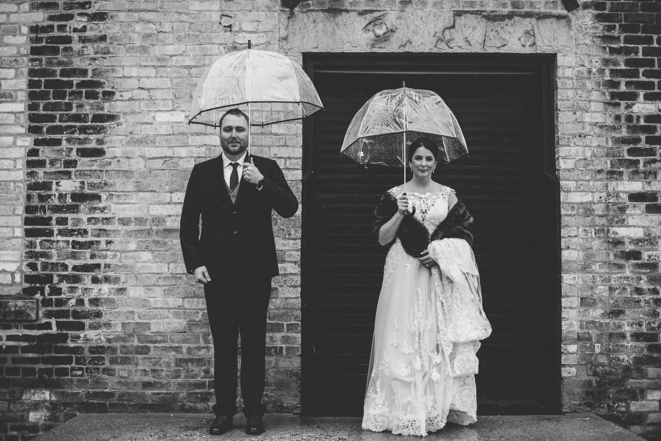 rainy bride and groom wedding photography.jpg
