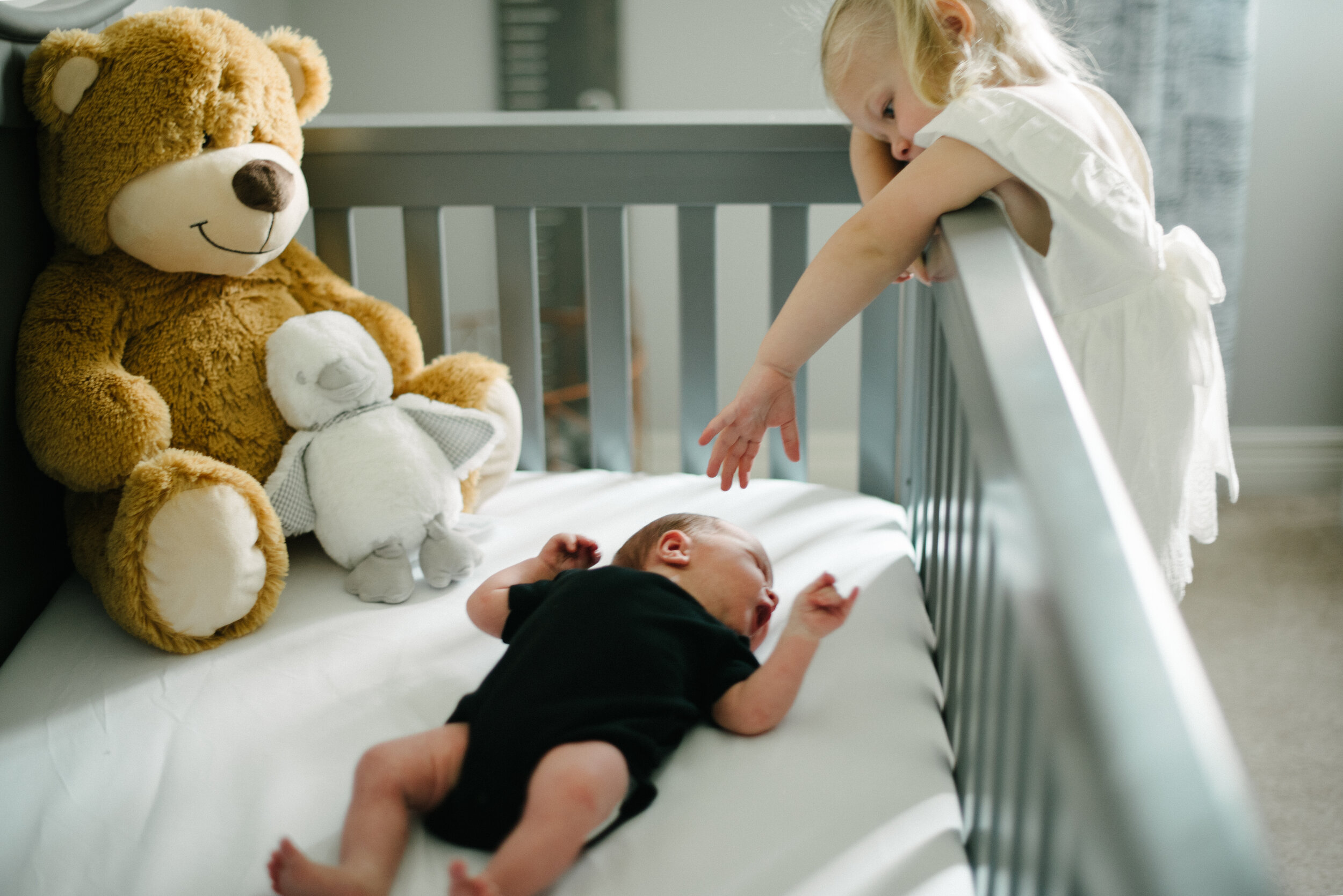 baby in crib family photoshoot.jpg