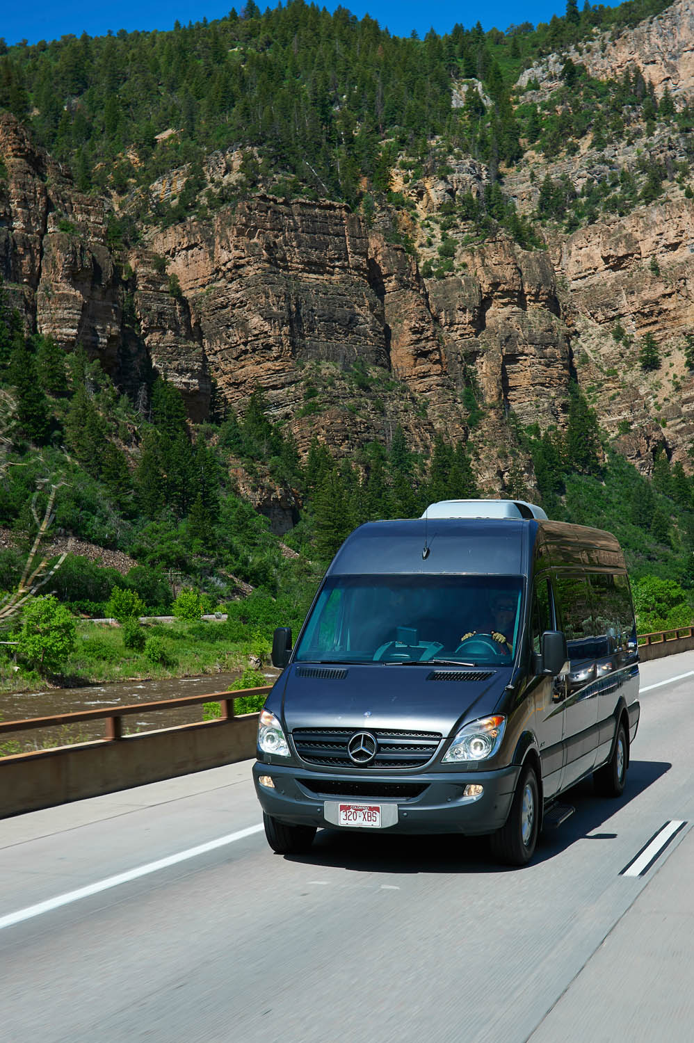  Colorado Mountain Express vehicle in Glenwood Canyon, Colorado. 