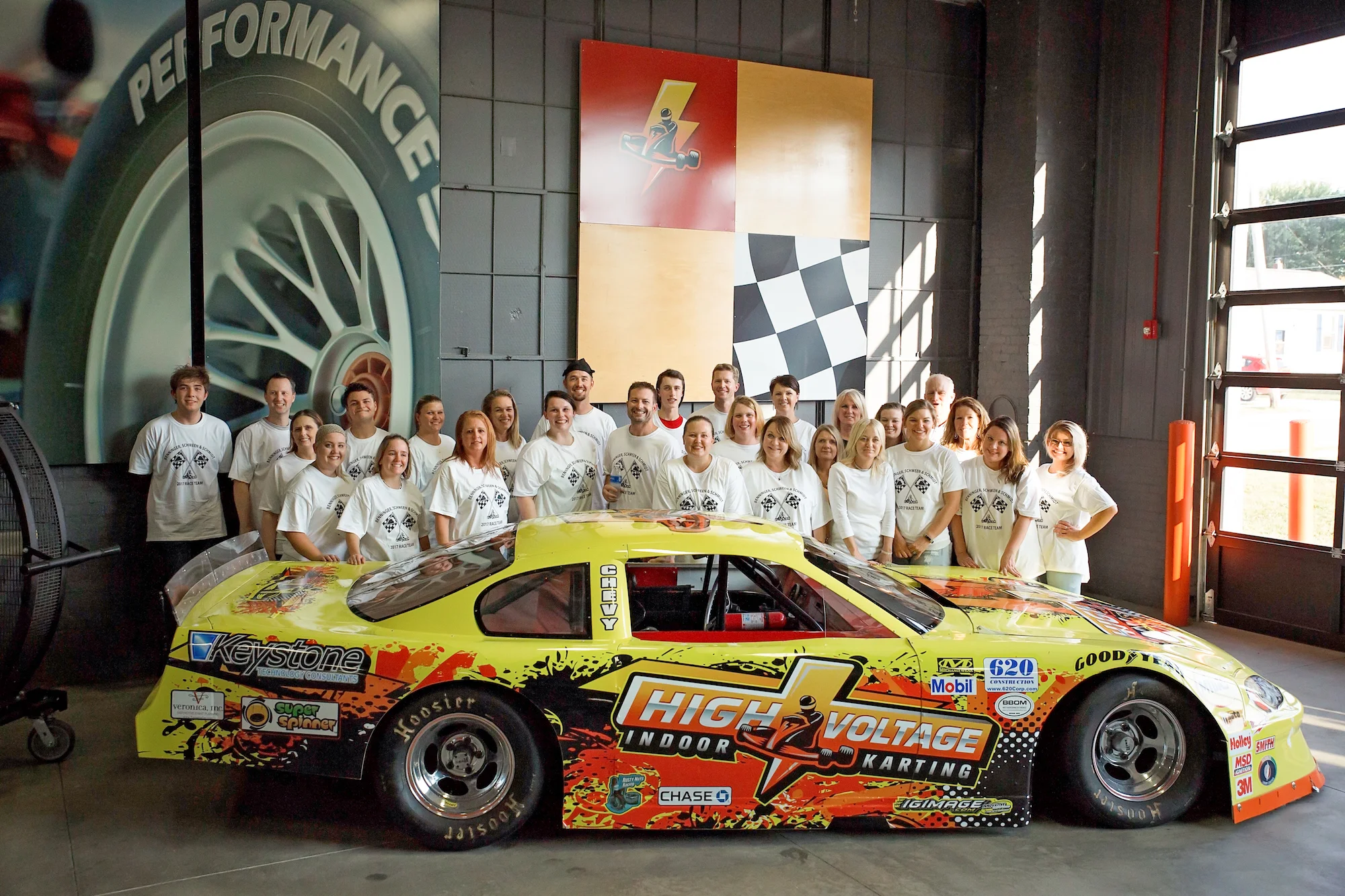 The Drs. Benninger, Schween, & Schmidt Team enjoy some high voltage indoor racing at a staff outing...