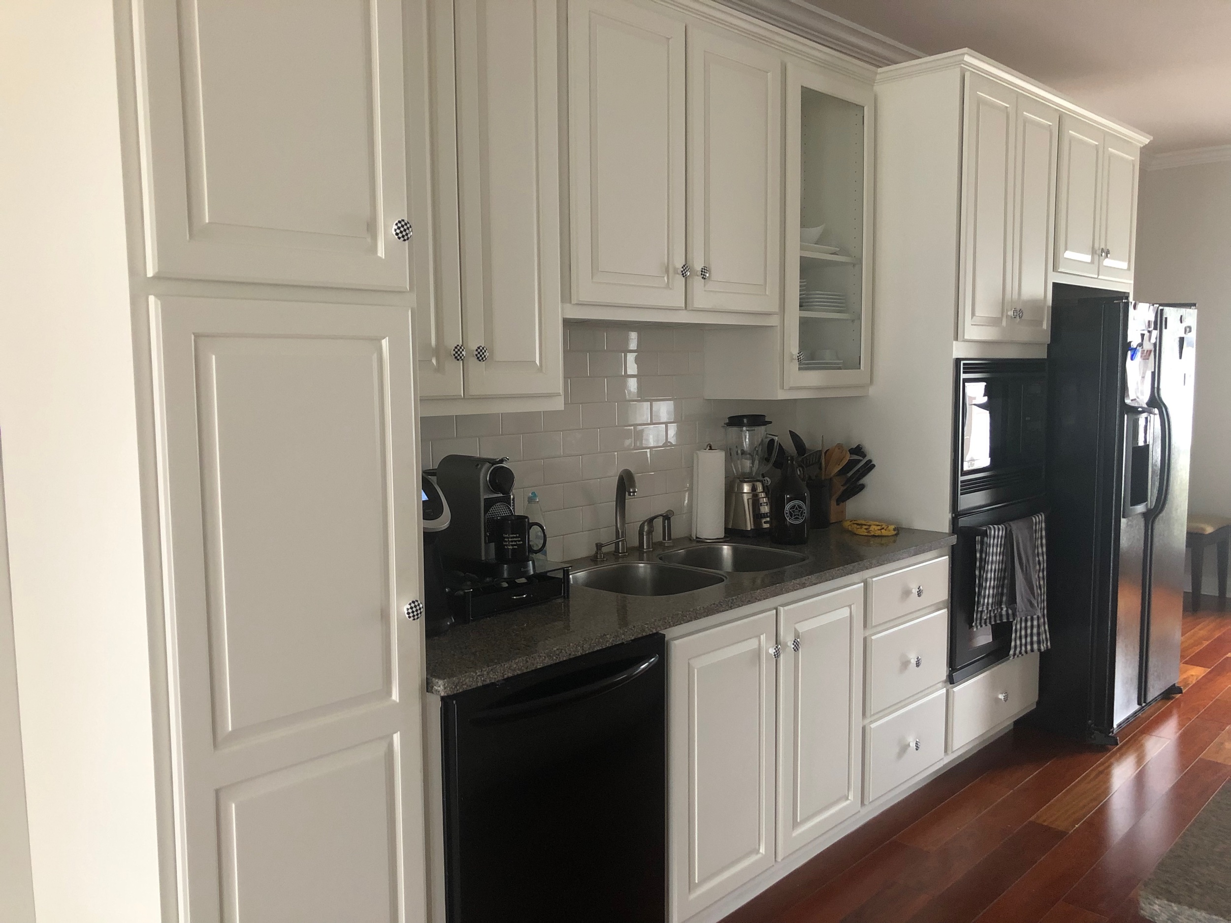 The open concept of this kitchen worked well in this downtown condo. A total remodel might have been overkill but painting gave the kitchen the update they were looking for.