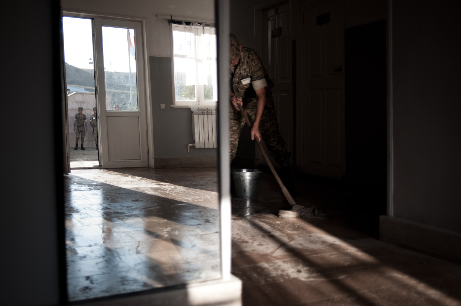  A young conscript on clean-up duty at the Jebrail military base in Southern Nagorno-Karabakh.   