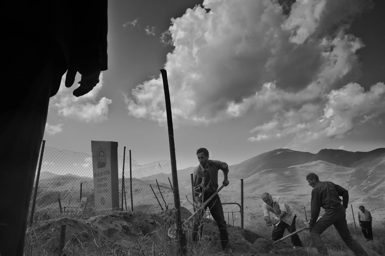 Men in Dastakert, mostly refugees from Azerbaijan, anxiously await the reopening of a copper plant which, despite its detrimental effects on health and the environment, promises desperately needed jobs. 