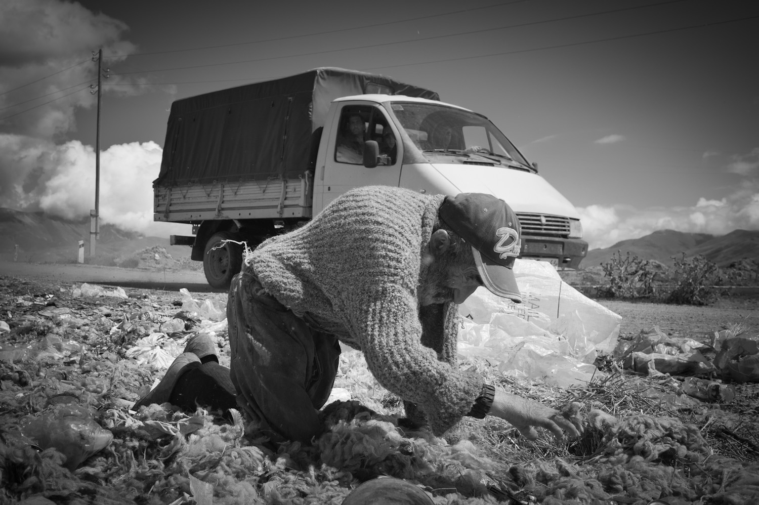  Robert Khachatryan, 69, rummages through a garbage dump in Metz Masrik village searching for items to burn for fuel. He is the eldest of an 11-member family and arrived to Armenia from Aygestan village in Azerbaijan.  