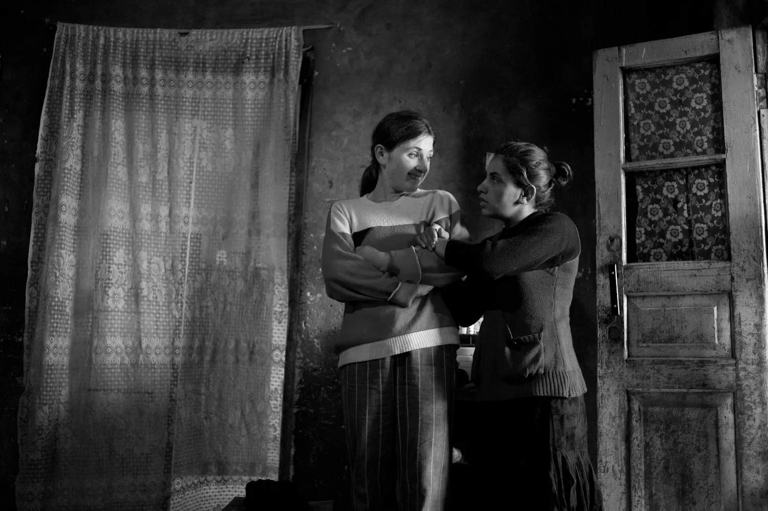 The Hovhannisyan family women at home in Shatvan village. Refugees from Azerbaijan, the family is unable to repay a $1000 bank loan they took out at 24% to buy seed for planting. A dry spell destroyed their potato crop and the cow used as collateral died.