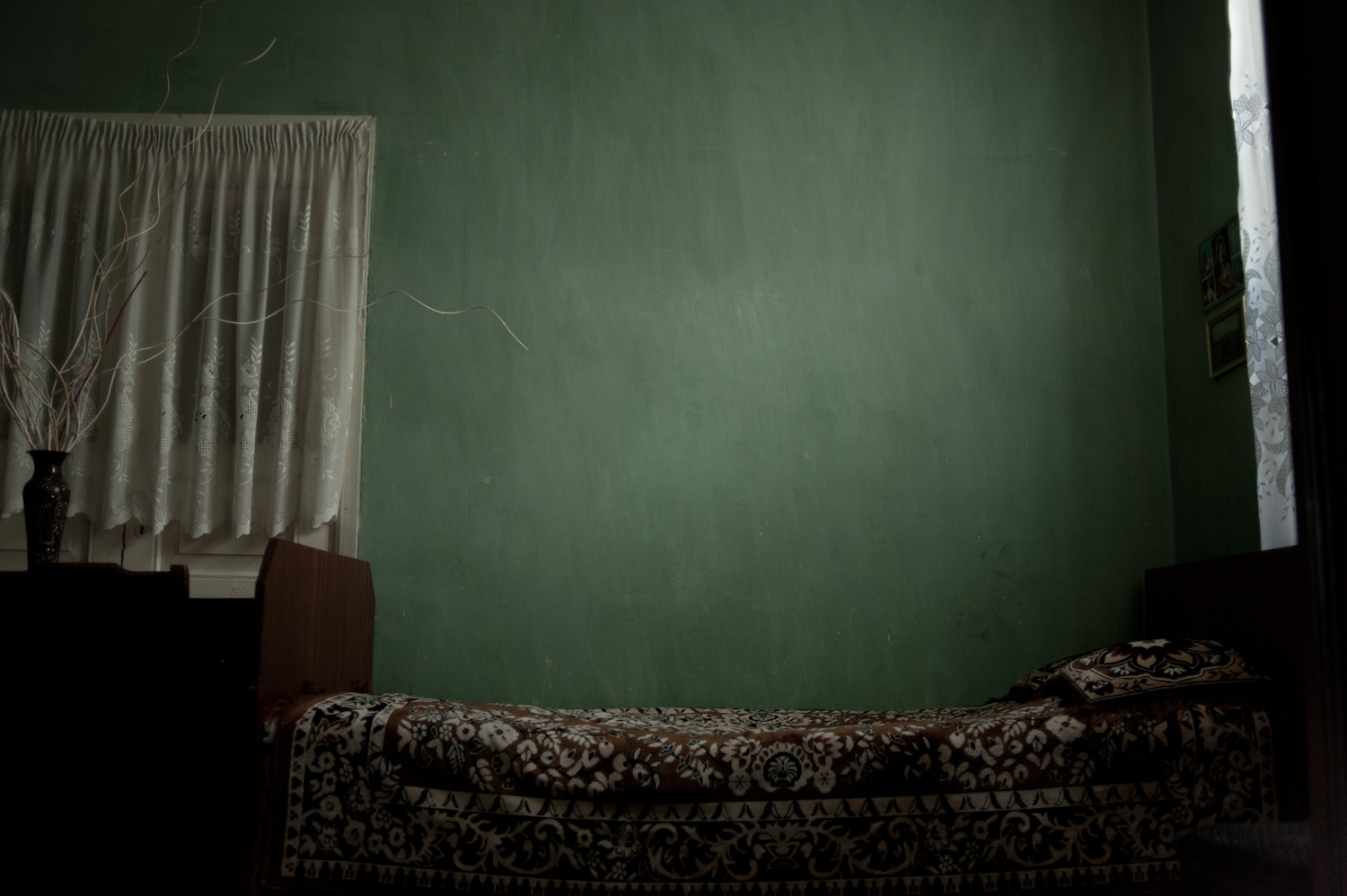 "My son and daughter slept in the same room, on two beds at opposite
sides of the room. Now that my son's bed is empty, my husband, daughter
and I will often sit or lie on it - it is the place where we feel
closest to him."