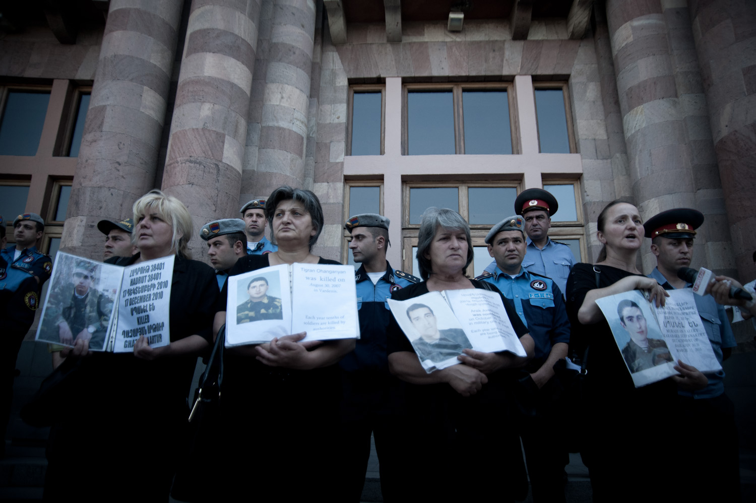 A group of soldiers' mothers stand in front of the government building at Yerevan's Republic Square every Thursday morning at 11am holding their sons' photographs and demanding that their cases be handled justly.