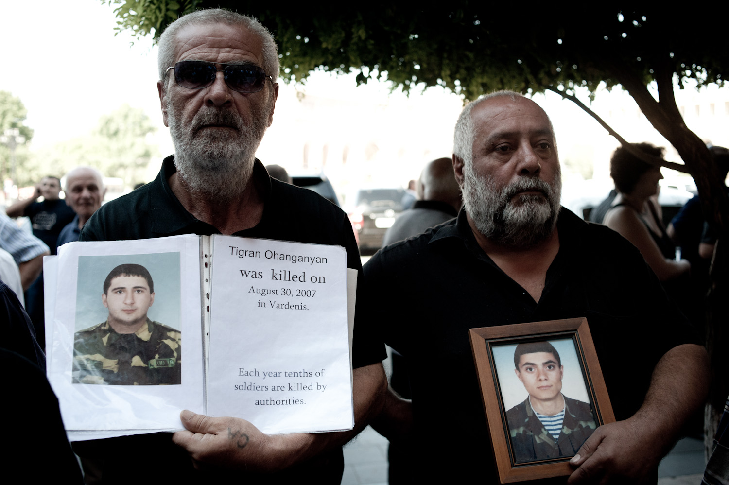 A year after Tigran's death, Tigran's father (left) was attacked twice by a group of men who hit him and warned him to stop protesting his son's death.