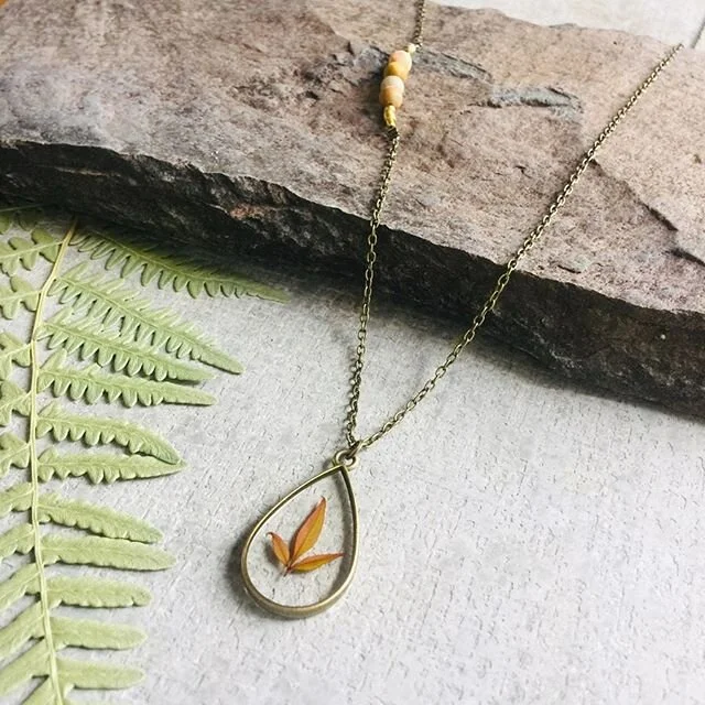 Celebrate mom, no matter the distance. 💕 Send her our new Heavenly Bamboo Necklace for Mother&rsquo;s Day!
*limited number available
.
.
.
.
.
.
.
.
.
#handmade #handmadejewelry #handmadewithlove #mothernature #mothersdaygift #shopsmall #shopsmallbusiness #heavenly #heavenlybamboo #oneofakind #resin #flowers #productphotography #makersmovement #prettylittlething