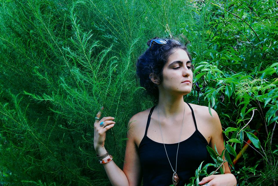 A photo of me with Elder (on the right) and a "Who plant" (on the left), taken by fellow herbalist and my incredible best friend, Miranda Murray.