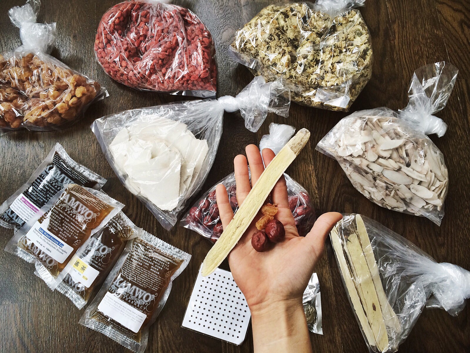 My haul - Longan berries (golden yellow color), Goji berries (red and tiny), Chrysanthemum flowers (yellow), White Peony root, Astragalus slices, Fu Shen (chalky white), and acupuncture ear seeds and few pre-made Chinese patents.