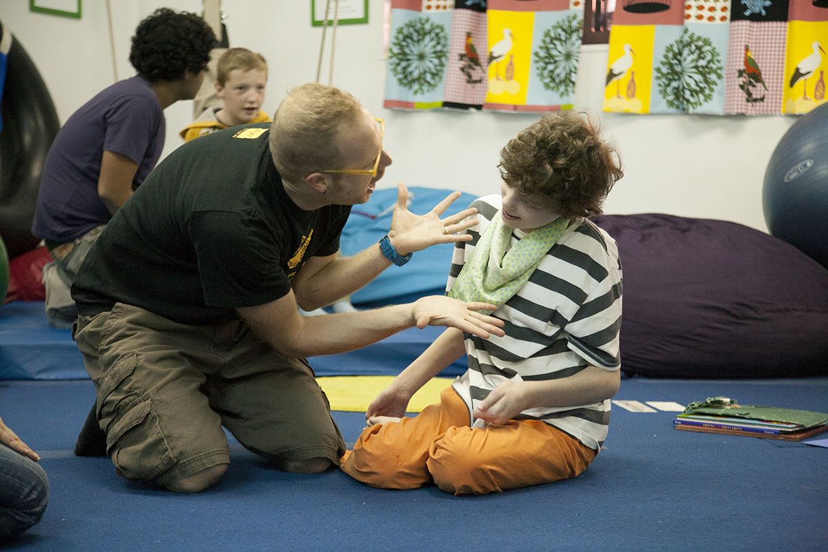 "Music with Jesse was fun for Harry. He has cerebral palsy , sensory integration dysfunction , and autism spectrum disorder . Although Harry is very social, his unusual behavior makes it difficult for people to connect with him. Jesse's exuberan