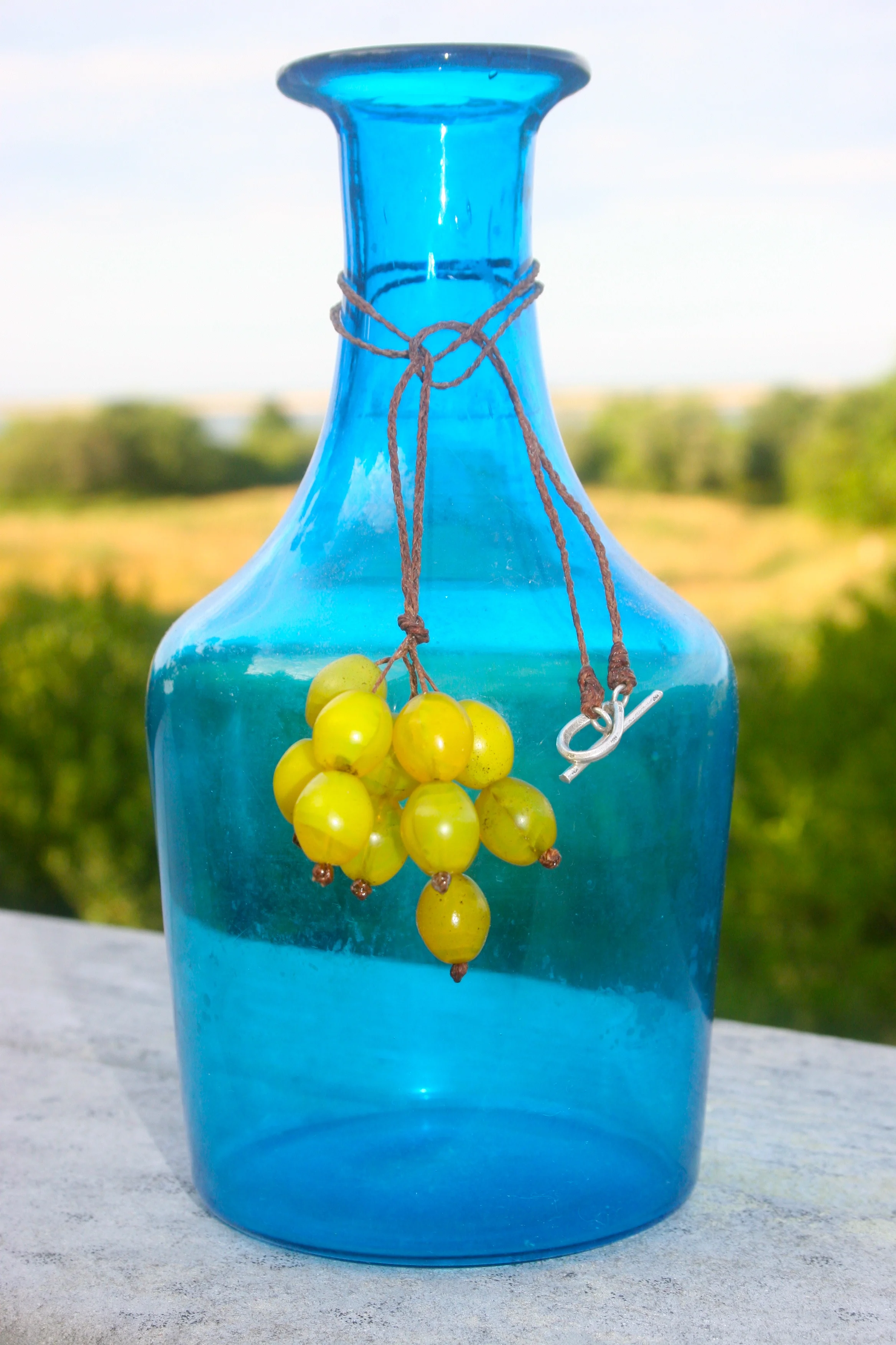 beads on blue glass jar.jpg