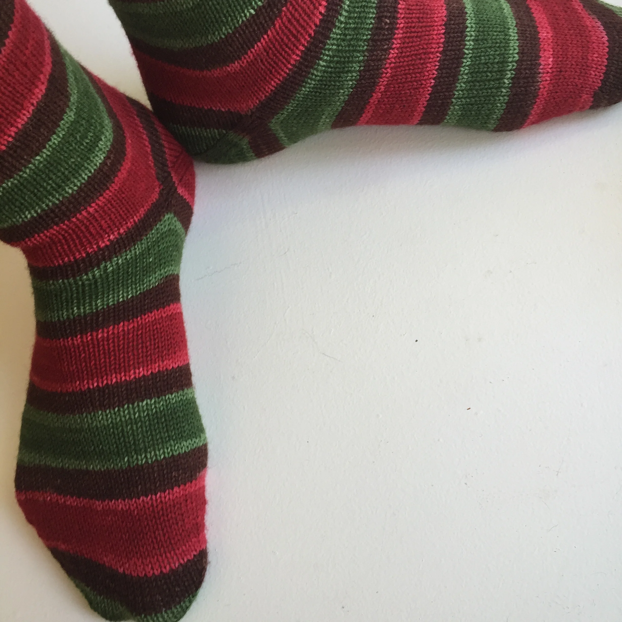 I used a forethought heel (like an afterthought heel, but without the cutting) and used a different color for each of the heels.