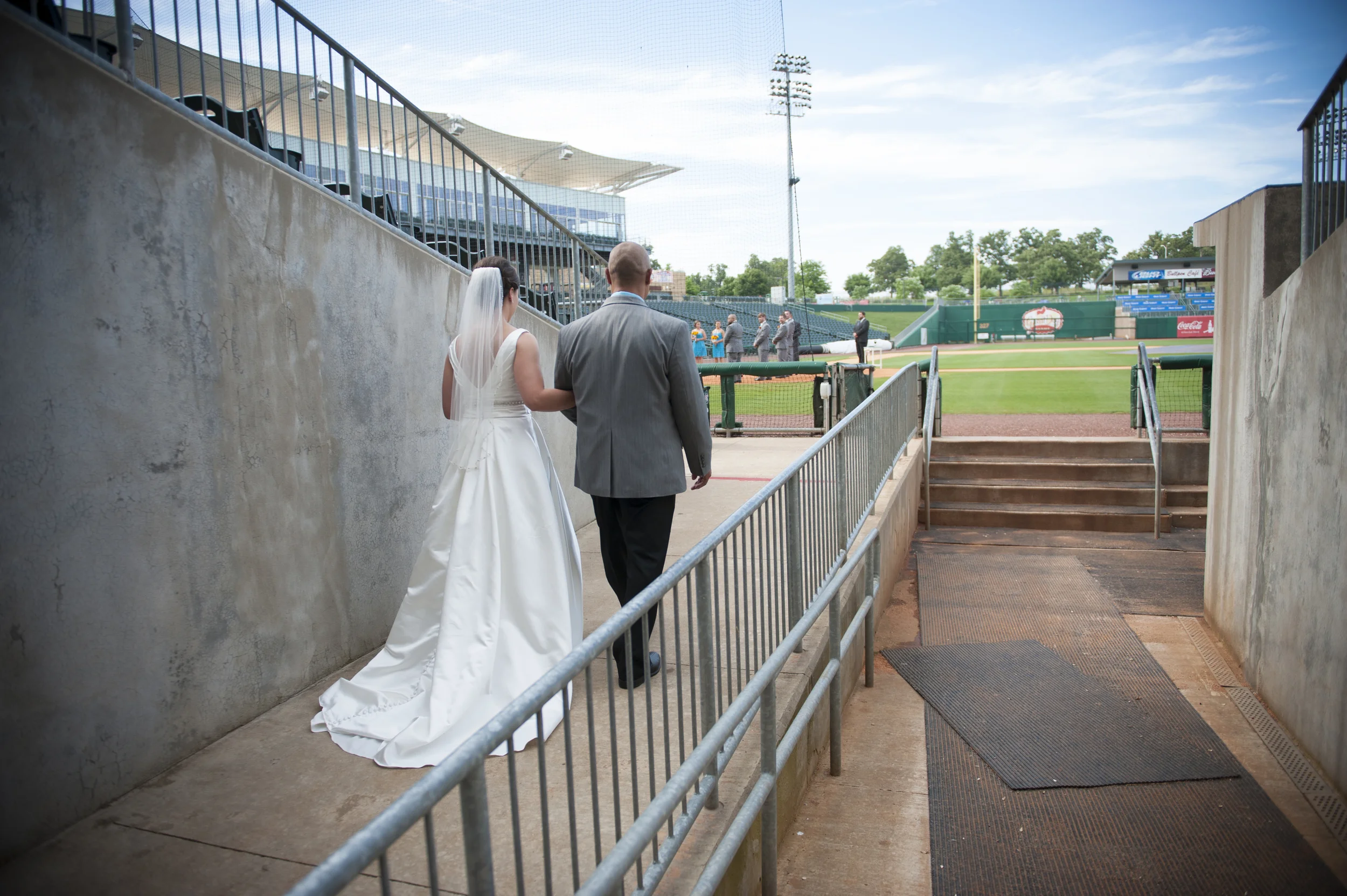Melanie got to walk out of the dugout to the aisle. So cool!
