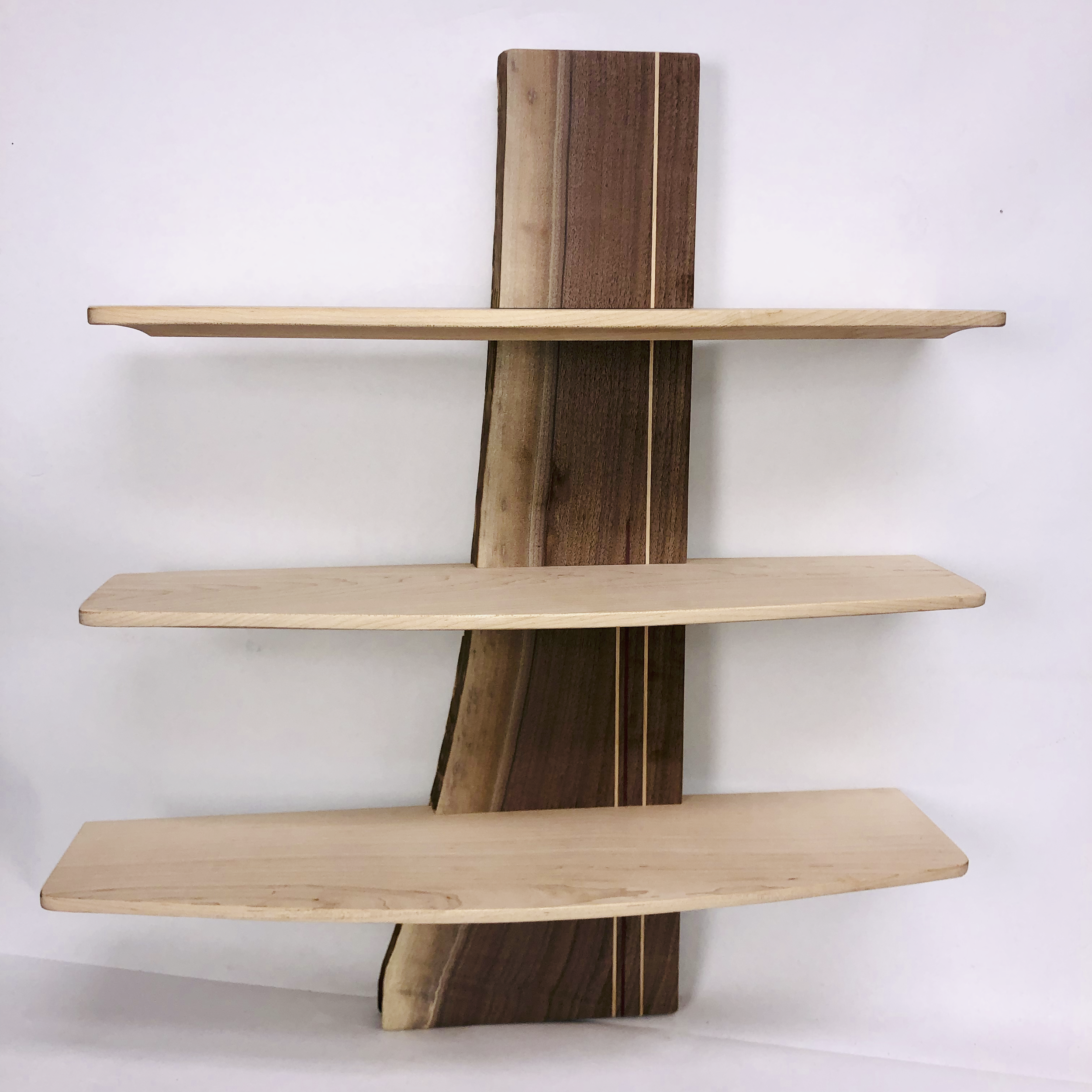 Free form shelf. Live edge walnut plank and maple shelves. Designed with 12th Street Design.