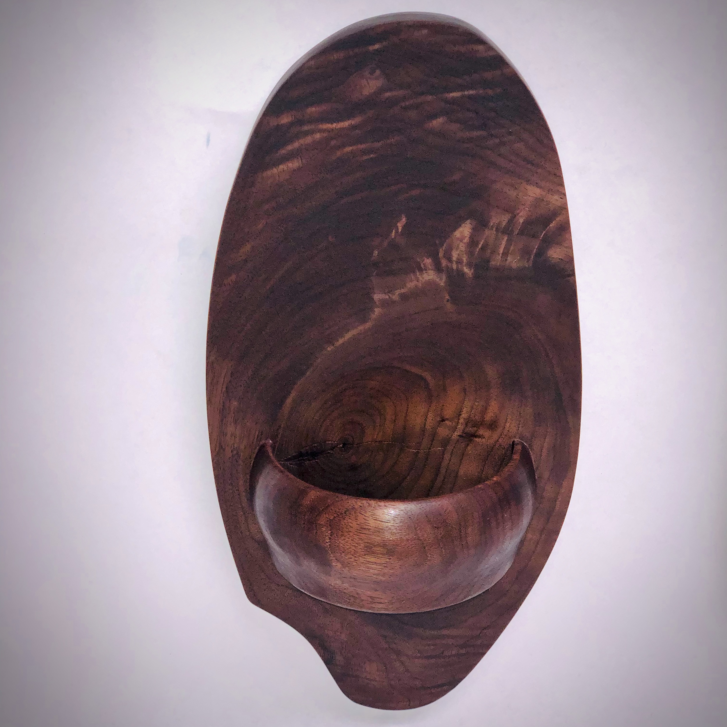 Design study for wall sconces to hold small plants or flowers. Walnut knot and half bowl.