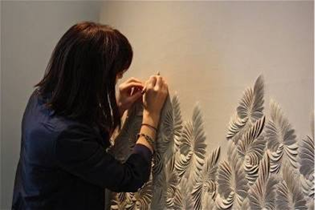 Contemporary artist, Helen Amy Murray working on her art.