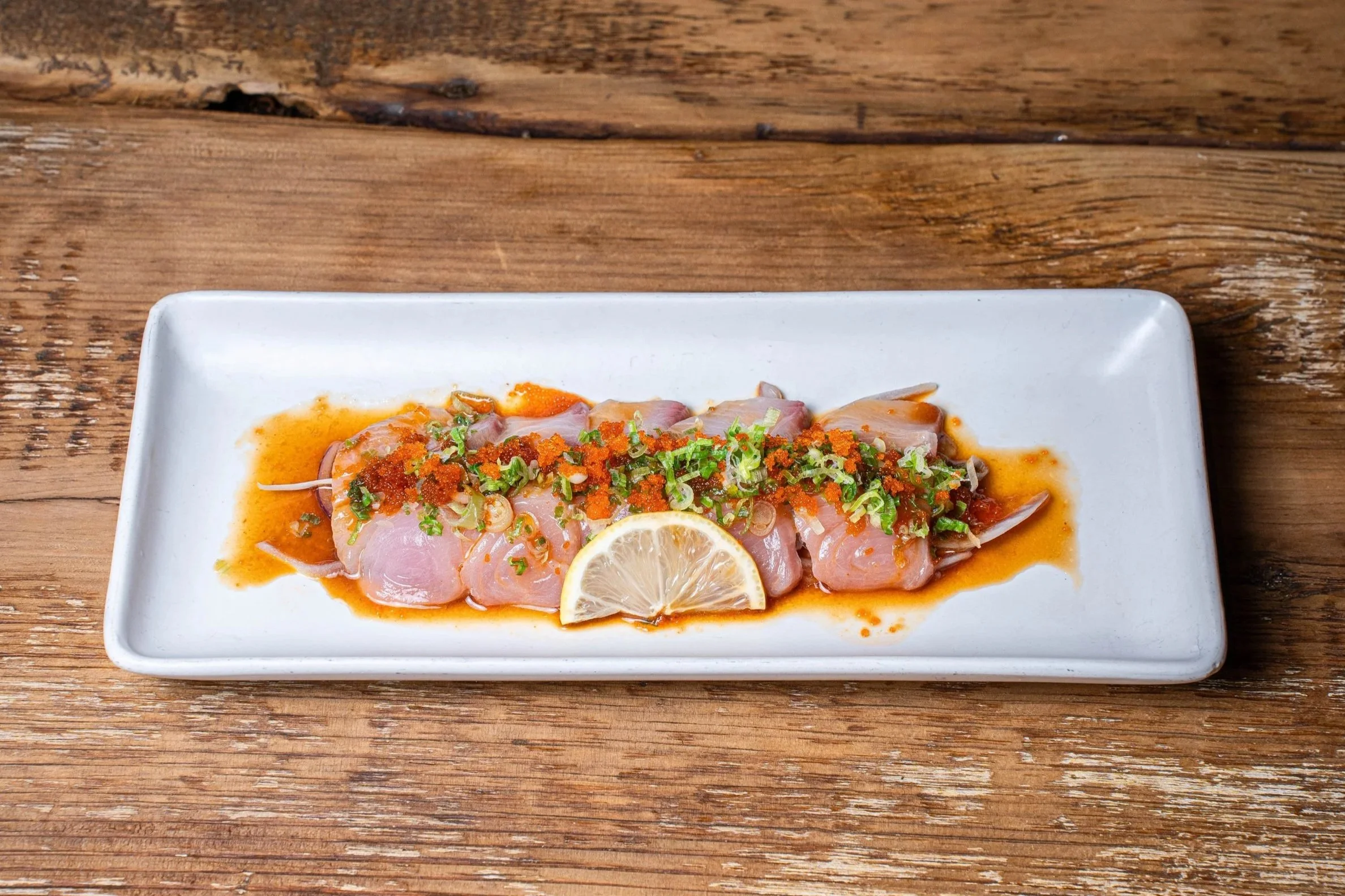 Yellowtail Carpaccio $13.95