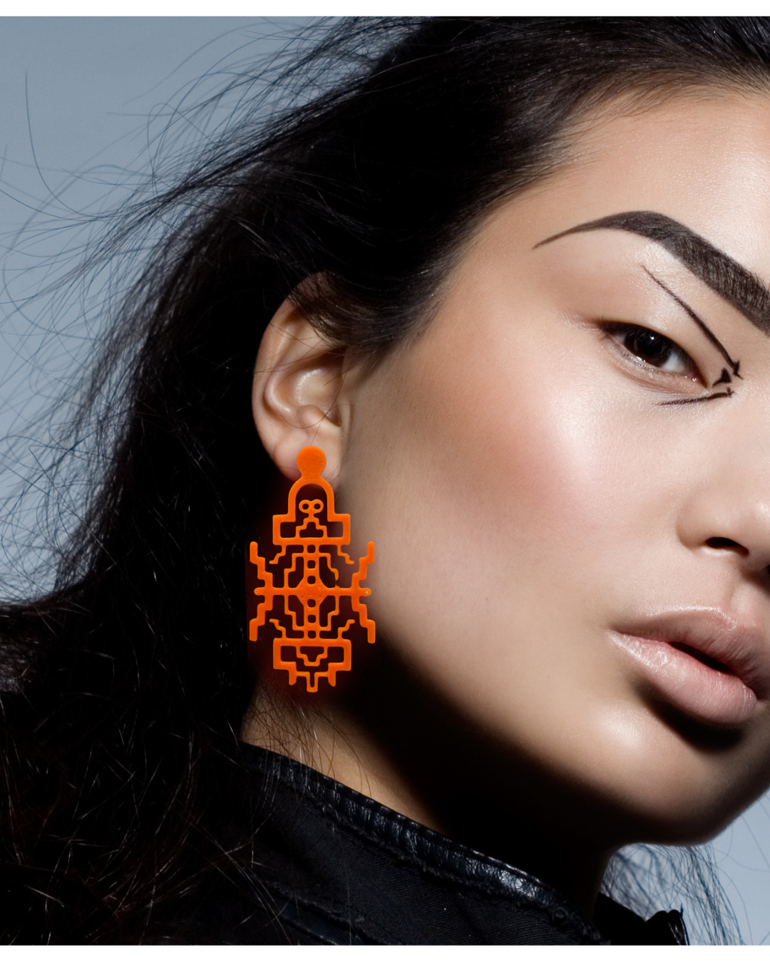 Big Bold Geometric Orange Drop earrings in a Statement proportion. 3d printed in Melbourne with sustainable Bio Polymers.