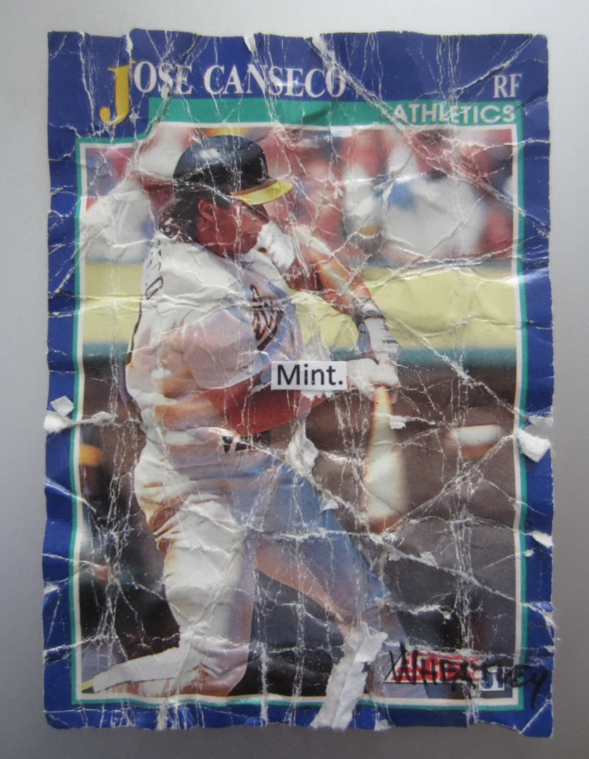 Jose Canseco. 3.5" x 2.5" mixed media. This piece addresses the obsession with mint condition. By crumbling the card up I created something that I find more interesting than before. I then signed the card and am now calling it art. I destroyed any value the card had as a baseball card and am asking if it has value as a work of art.