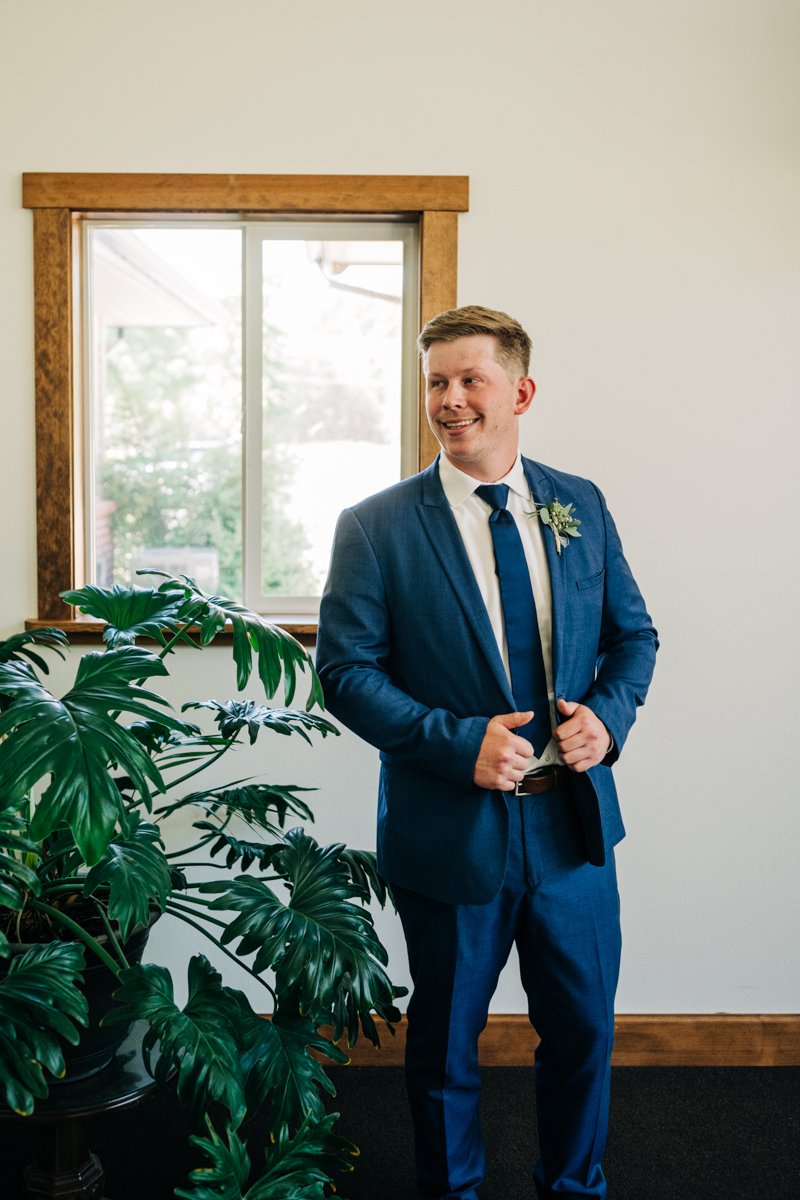 groom in navy tux