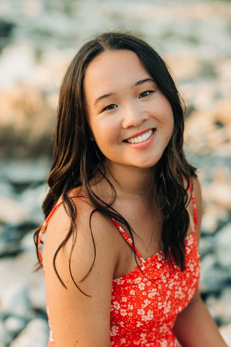 senior in red top near rocks.jpg