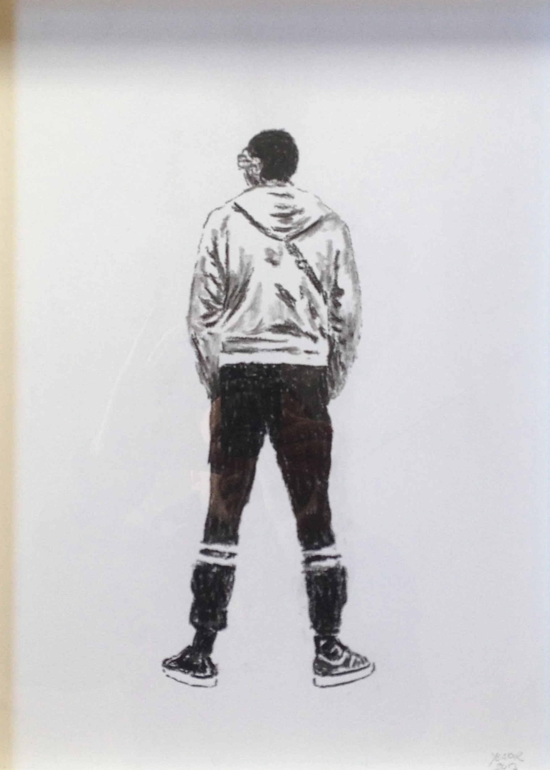 boy in track pants standing coal drawing