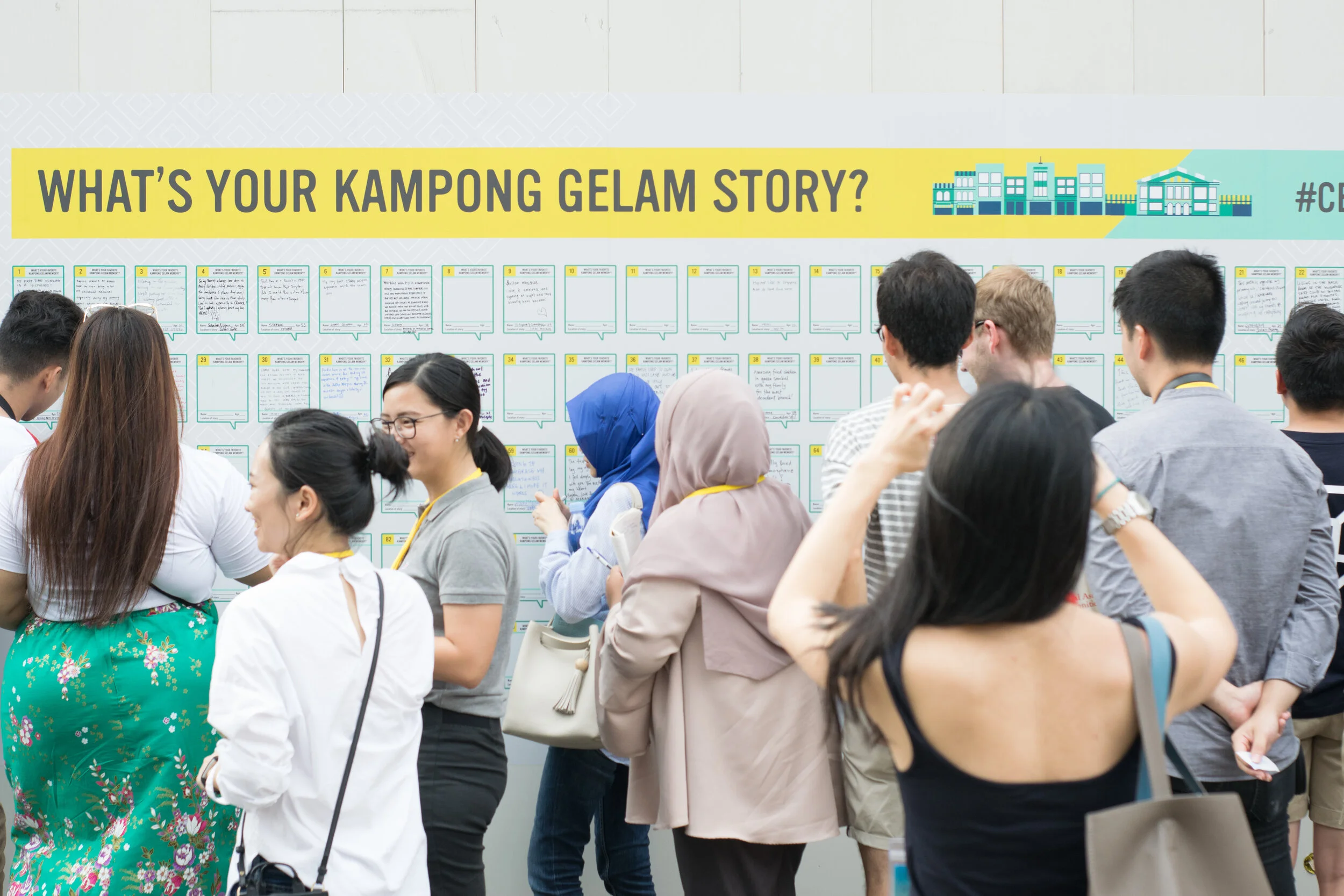 Passers-by stop to sharing their memories of the neighborhood during a festival.