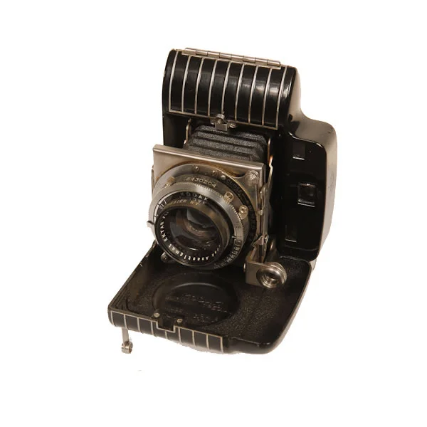 Kodak Bantam Special 1936-1940. The name "Special" indicates superior finish for Kodak cameras. In this case the camera has an art-deco styling. The Bantam cameras were folding cameras that used 828 film. 828 film was like 35mm but it did not have any perforation on either side of the roll.