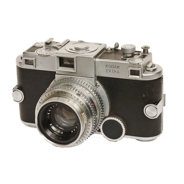 Kodak Ektra 1941-1948. A 35mm rangefinder camera, the Ektra was loaded with bells and whistles and steel. It was very heavy at over 2 lbs. It had interchangeable lenses and magazine backs. It had a focal plane shutter that went up to 1/1000 sec. This camera was part of the antique camera collection acquired from Bernie Boston.