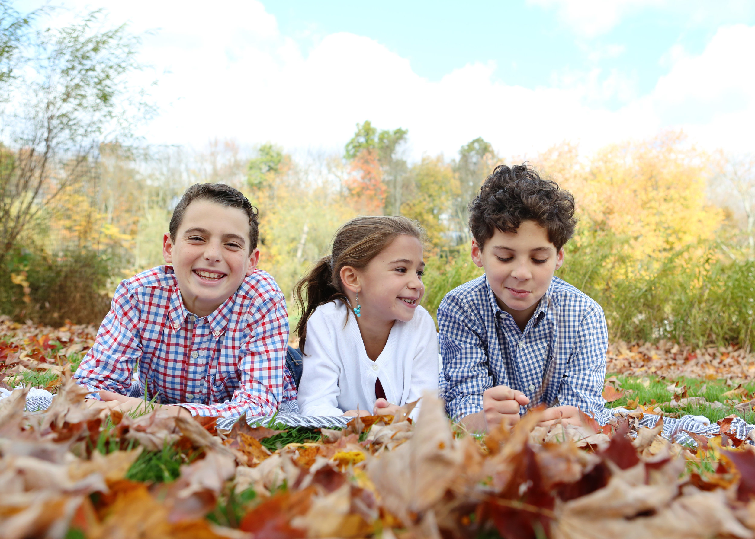 NJ and NYC based lifestyle photographer | Jennifer Lavelle Photography |  children and families, newborn, lifestyle, interiors, food and travel. Siblings playing in the leaves.