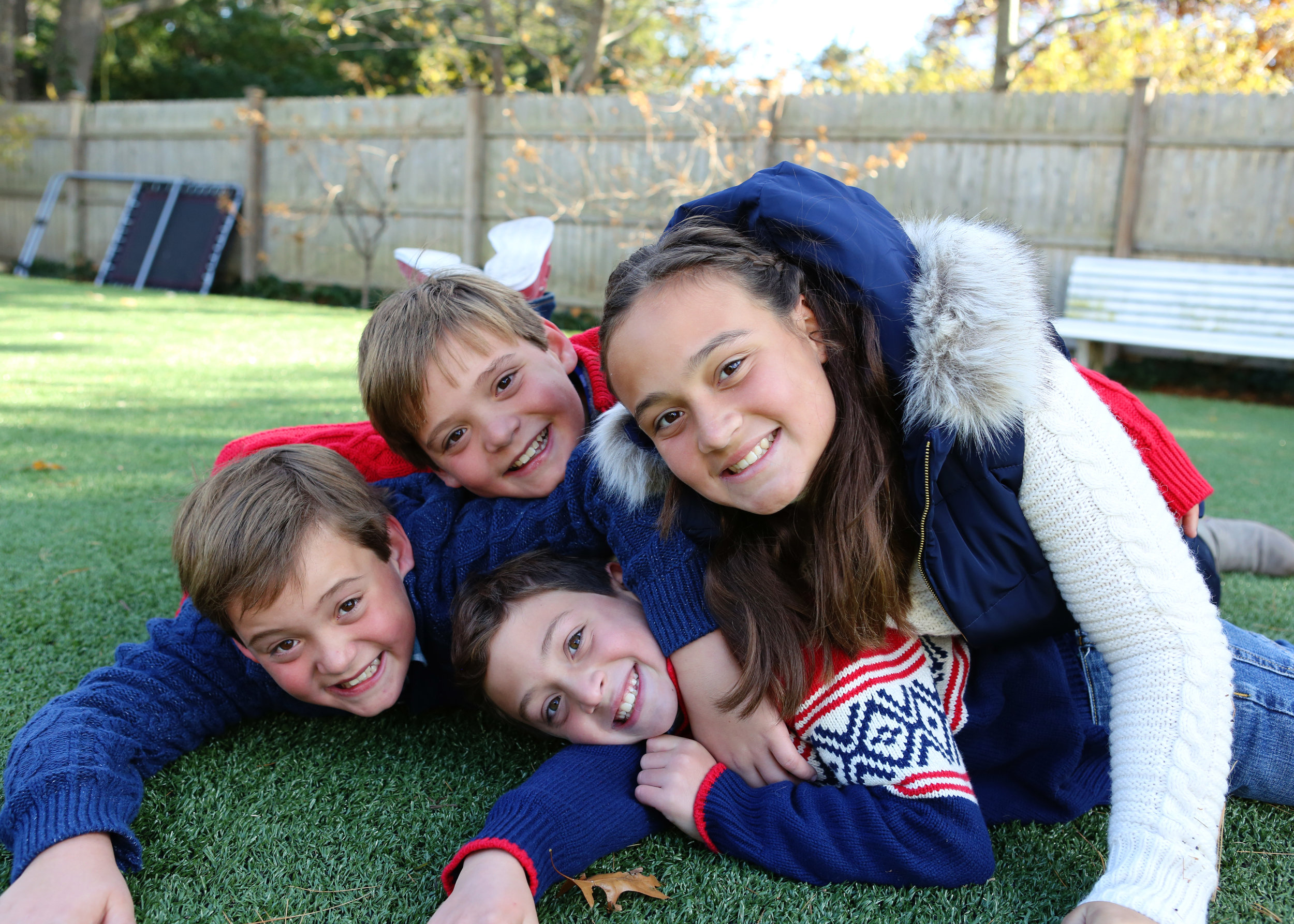 NJ and NYC based lifestyle photographer | Jennifer Lavelle Photography |  children and families, newborn, lifestyle, interiors, food and travel.  Siblings playing on the grass.