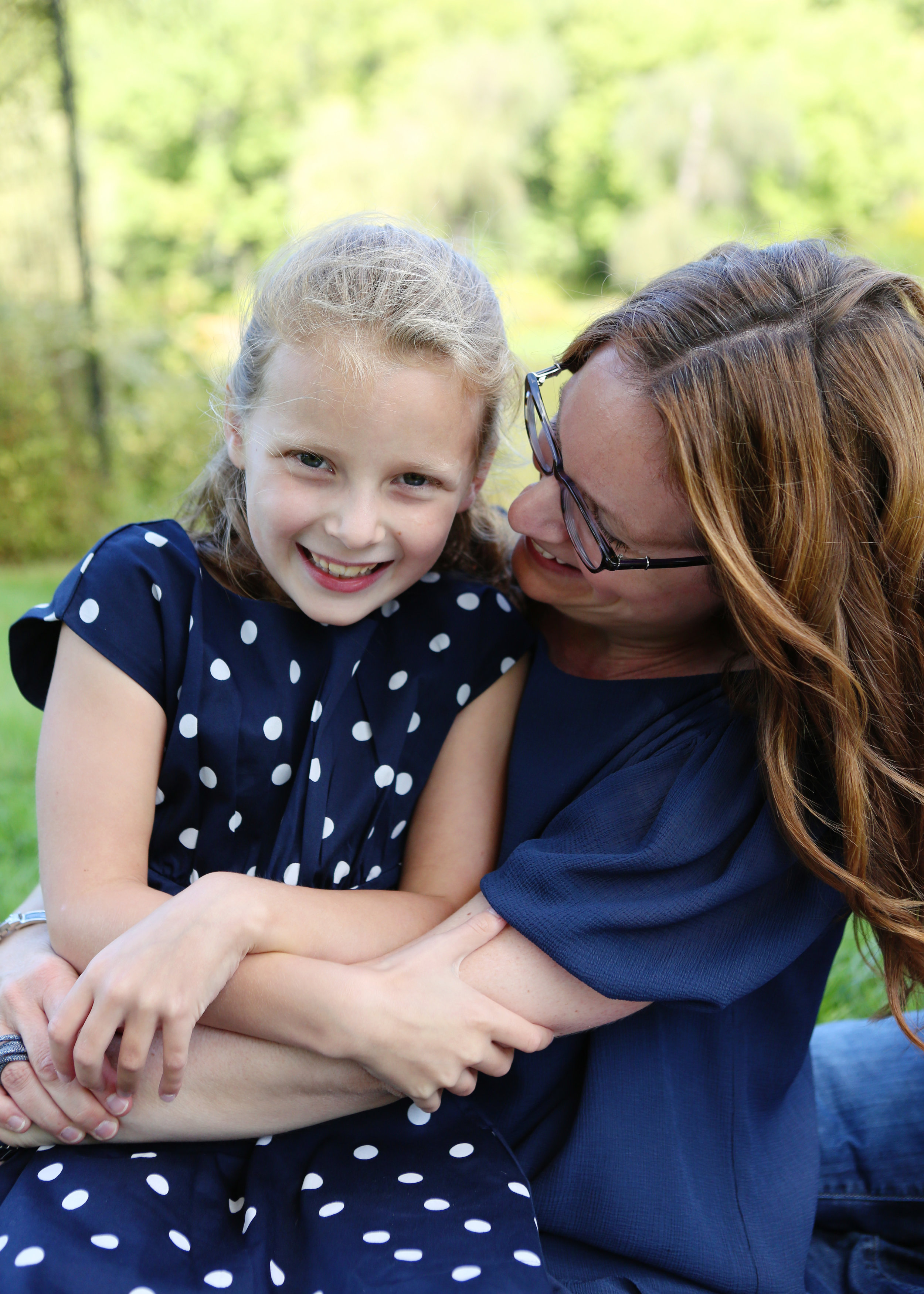 NJ and NYC based lifestyle photographer | Jennifer Lavelle Photography |  children and families, newborn, lifestyle, interiors, food and travel.   Mom and daughter laughing in park.