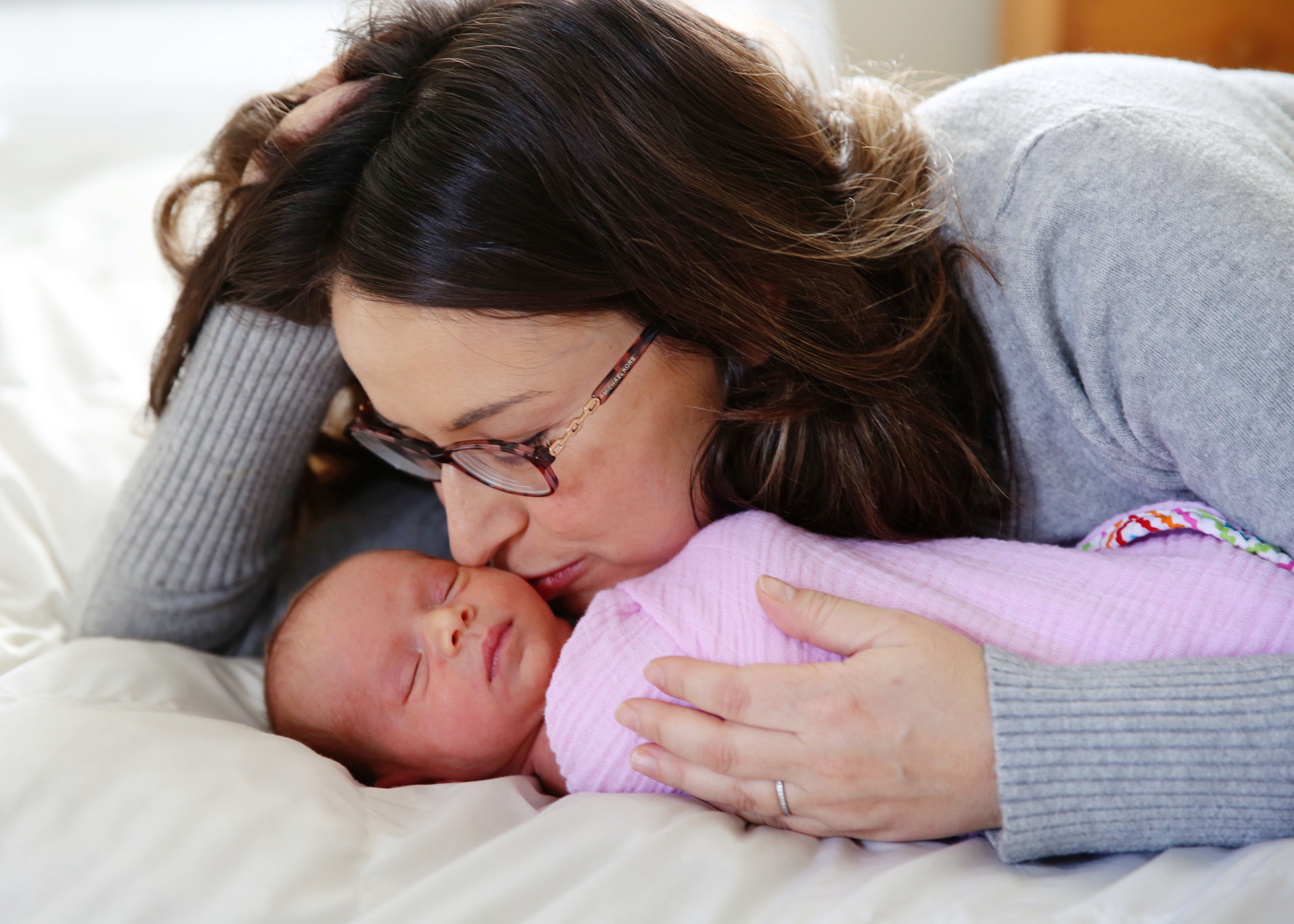 Chatham, NJ based lifestyle photographer Jennifer Lavelle Photography -  newborn, children, family lifestyle photography  |  mom and newborn on bed