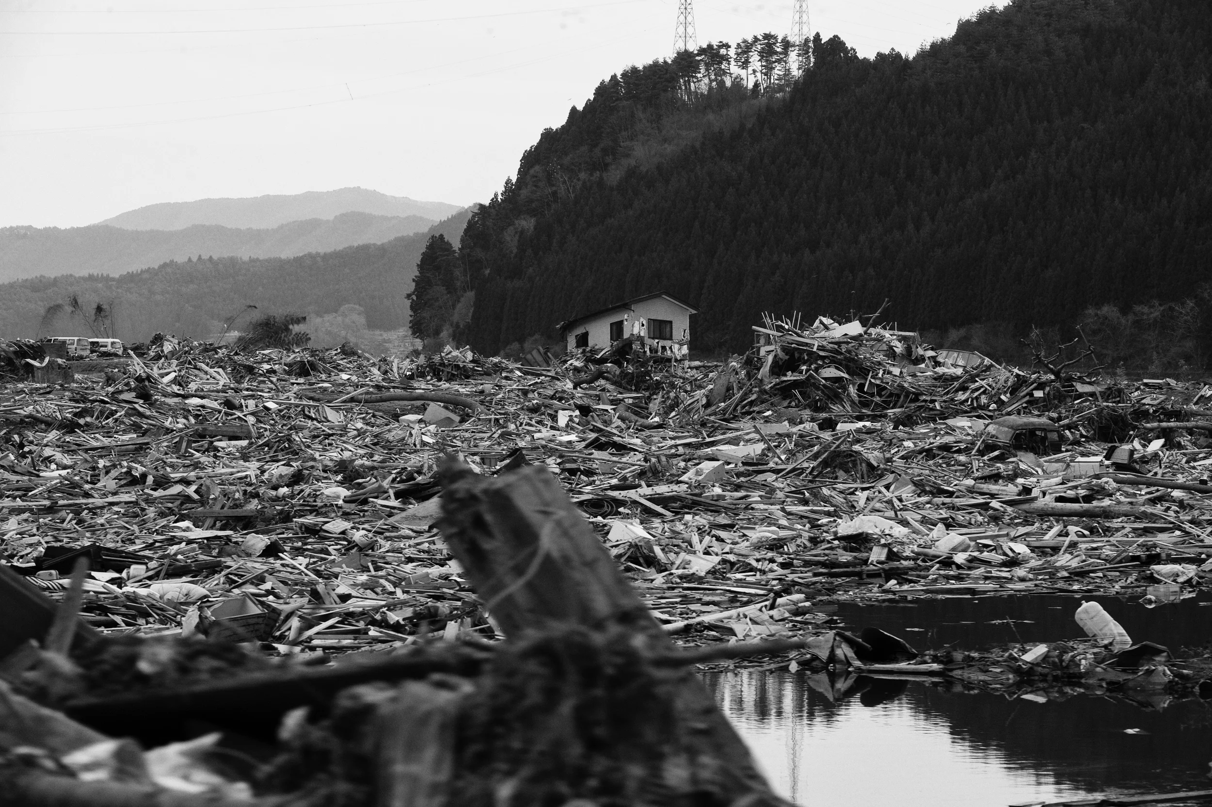 The Government of Japan estimated that the 2011 Tōhoku earthquake and tsunami destroyed 120,000 buildings, damaged 220,000 others, and washed another 78,000 buildings into the sea. A house in Ofunato, Iwati Prefecture, March 26, 2011. (Photo/Mark Pearson)