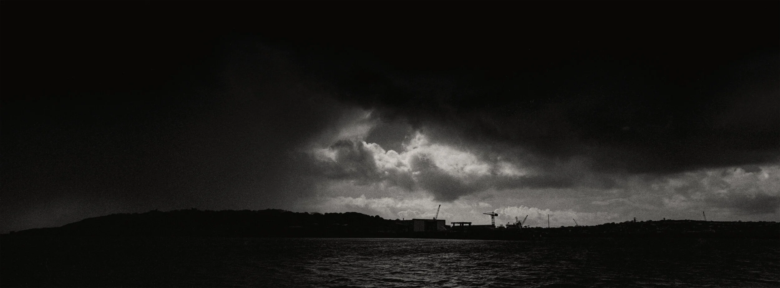 During World War Two, in an effort to prevent Nazi air and sea strikes, the strategicically important deep-sea port of Falmouth was heavily defended and played a massive part in the war effort. View of the dockyard during storm Jorge Falmouth, Cornw…