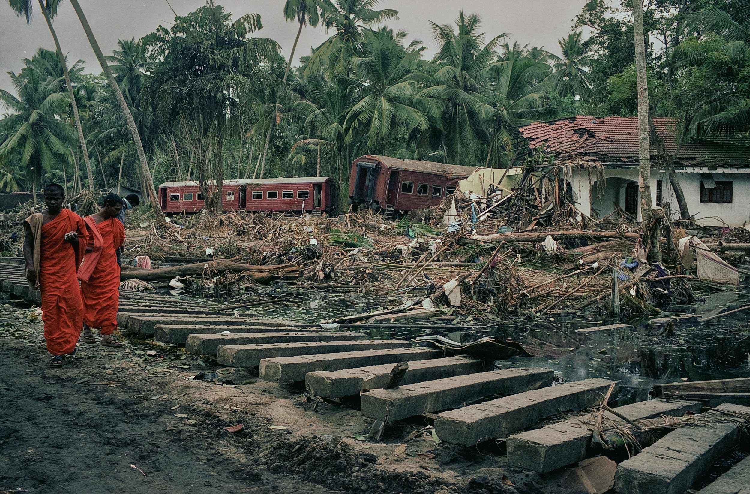 On Dec 26, 2004, a tsunami hit Sri Lanka, derailing the "Queen of the Sea" train, killing 1,700-2,500 passengers, and leaving only about 150 survivors. Telwatta, Sri Lanka, December 31, 2004 © Mark Pearson