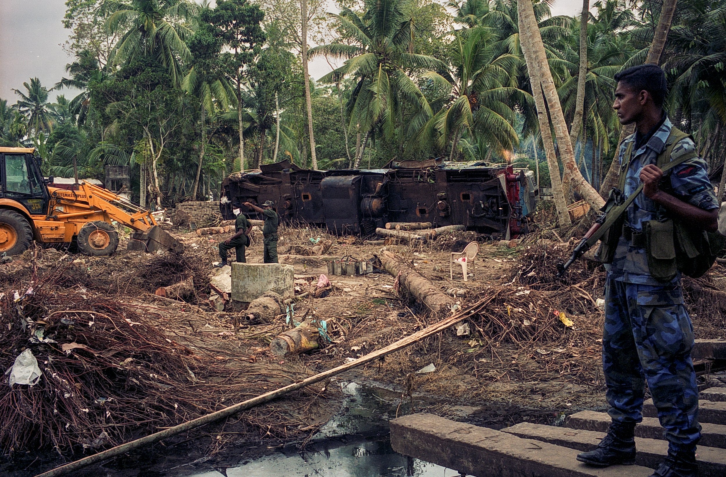 On Dec 26, 2004, a tsunami hit Sri Lanka, derailing the "Queen of the Sea" train, killing 1,700-2,500 passengers, and leaving only about 150 survivors. Telwatta, Sri Lanka, December 31, 2004 © Mark Pearson