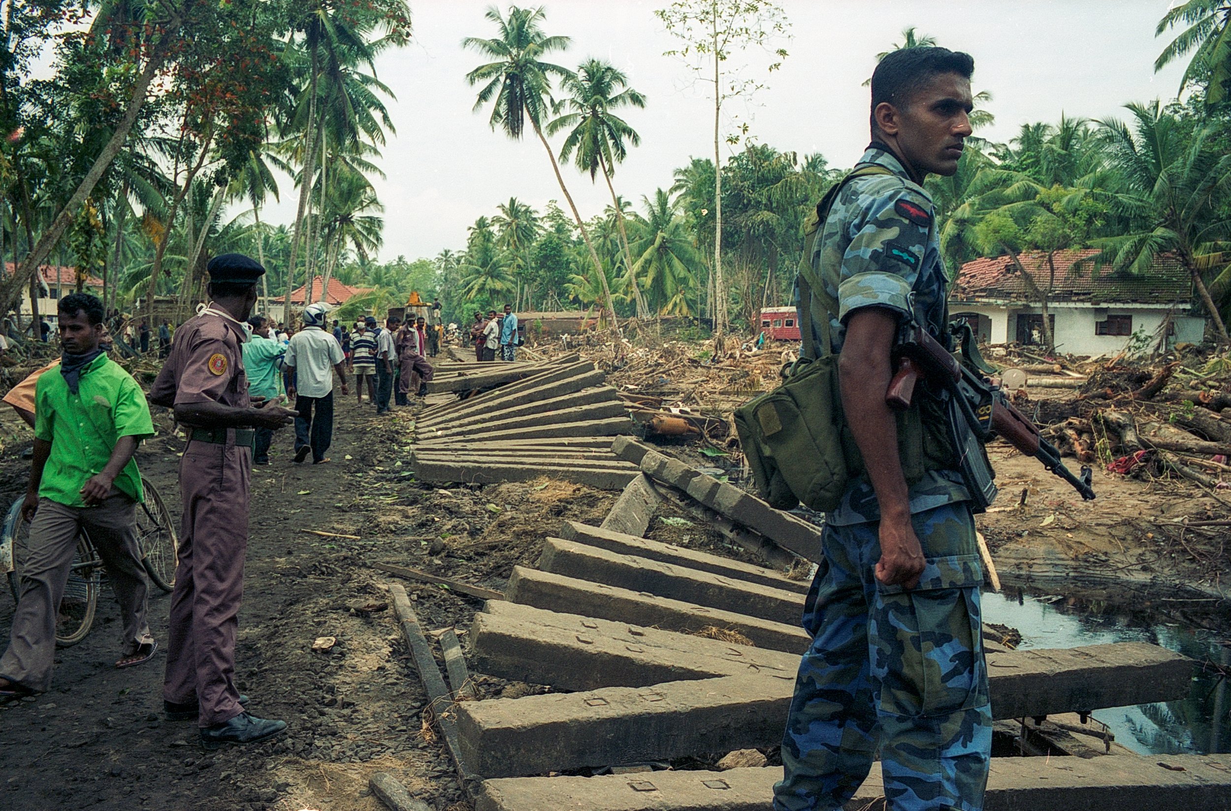 On Dec 26, 2004, a tsunami hit Sri Lanka, derailing the "Queen of the Sea" train, killing 1,700-2,500 passengers, and leaving only about 150 survivors. Telwatta, Sri Lanka, December 31, 2004 © Mark Pearson