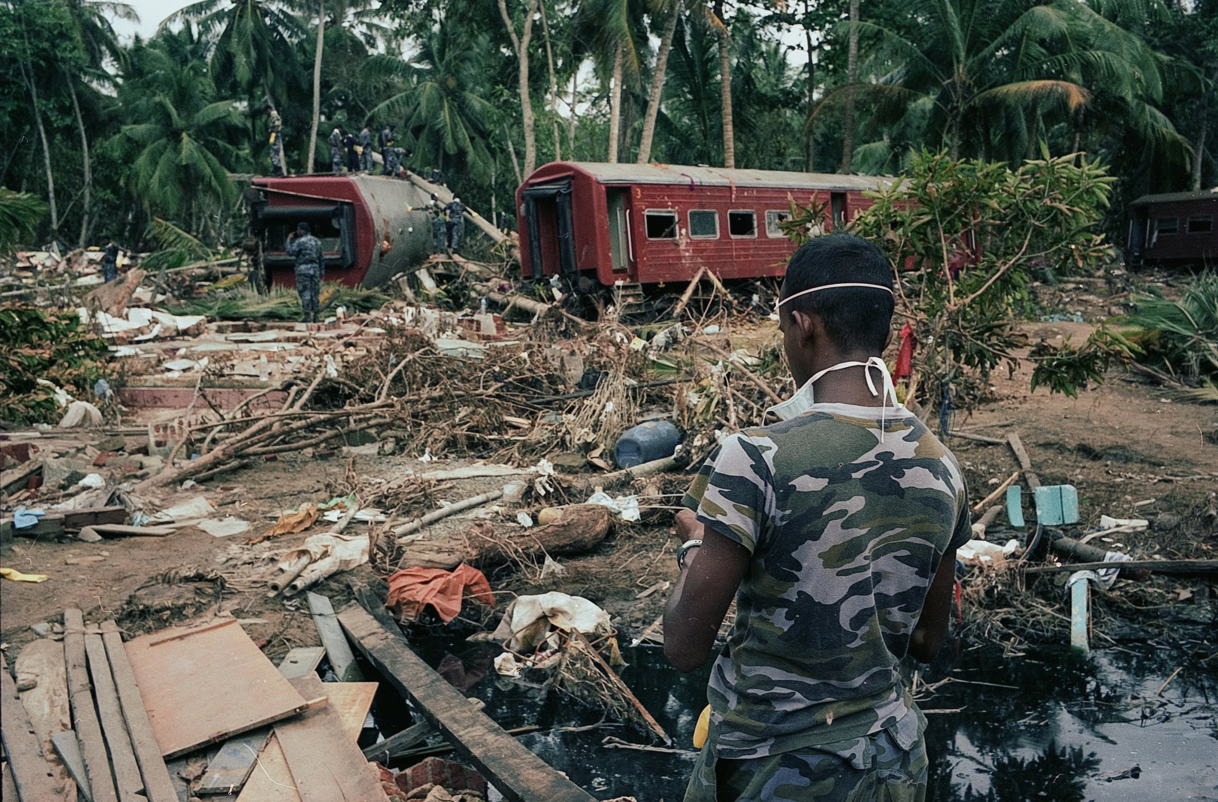 On Dec 26, 2004, a tsunami hit Sri Lanka, derailing the "Queen of the Sea" train, killing 1,700-2,500 passengers, and leaving only about 150 survivors. Telwatta, Sri Lanka, December 31, 2004 © Mark Pearson