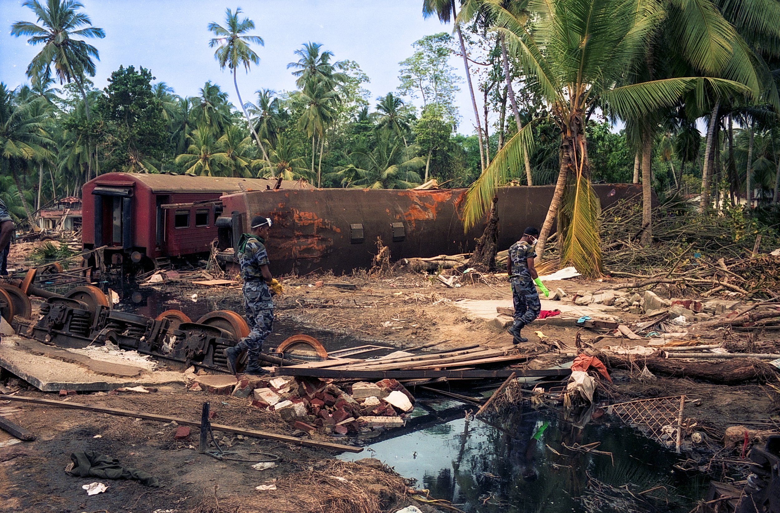 On Dec 26, 2004, a tsunami hit Sri Lanka, derailing the "Queen of the Sea" train, killing 1,700-2,500 passengers, and leaving only about 150 survivors. Telwatta, Sri Lanka, December 31, 2004 © Mark Pearson
