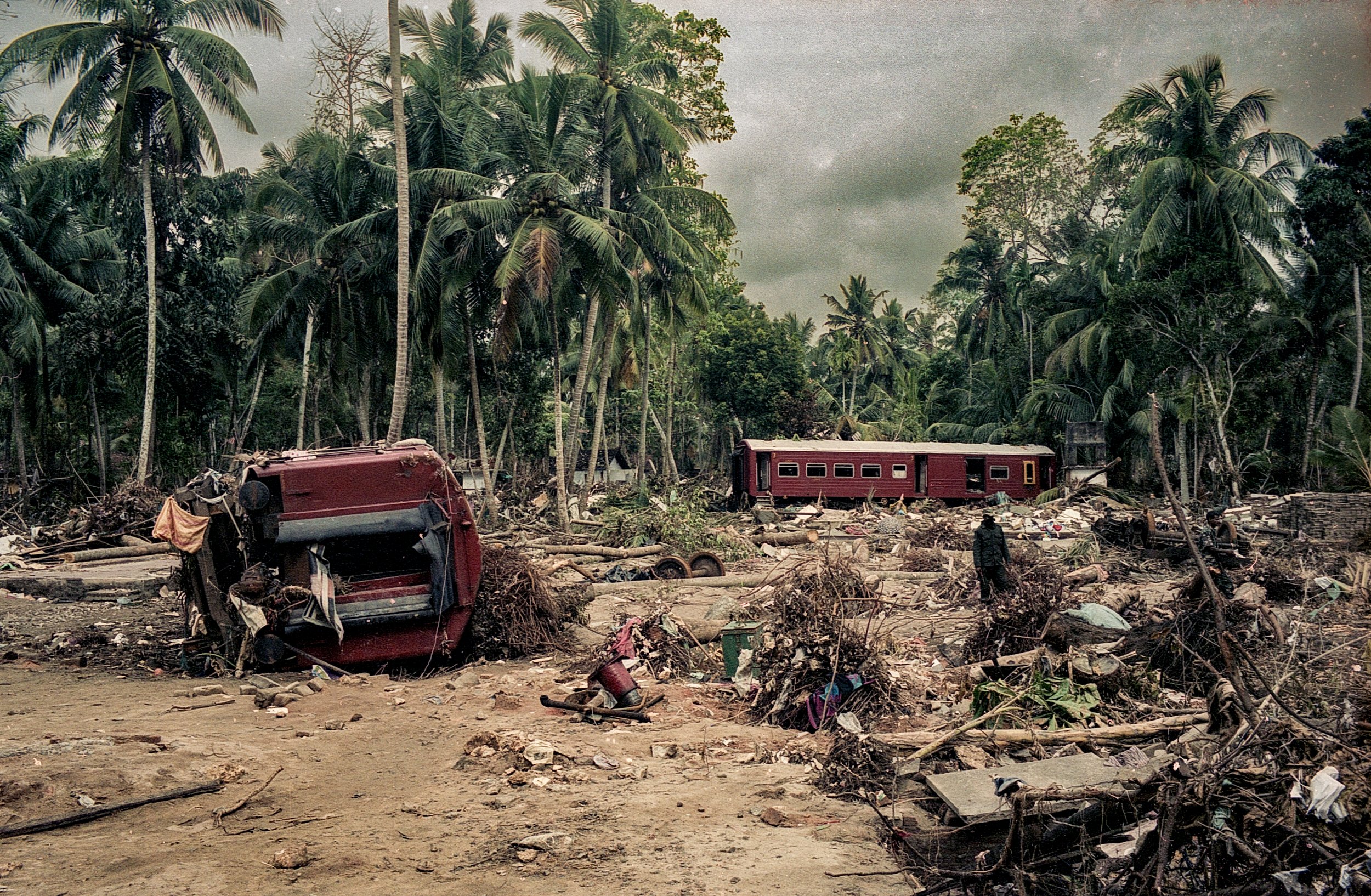On Dec 26, 2004, a tsunami hit Sri Lanka, derailing the "Queen of the Sea" train, killing 1,700-2,500 passengers, and leaving only about 150 survivors. Telwatta, Sri Lanka, December 31, 2004 © Mark Pearson