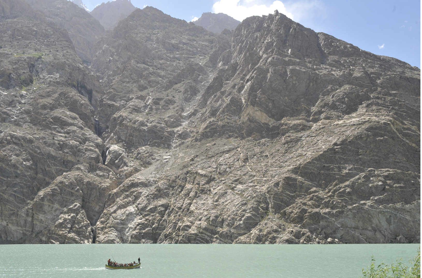   Upper Hunza, Pakistan — 2010:  A landslide dammed the Hunza River, forming Attabad Lake and cutting road access along the Karakoram Highway, forcing displaced residents to move by boat and improvised routes. (Photo/Mark Pearson) 