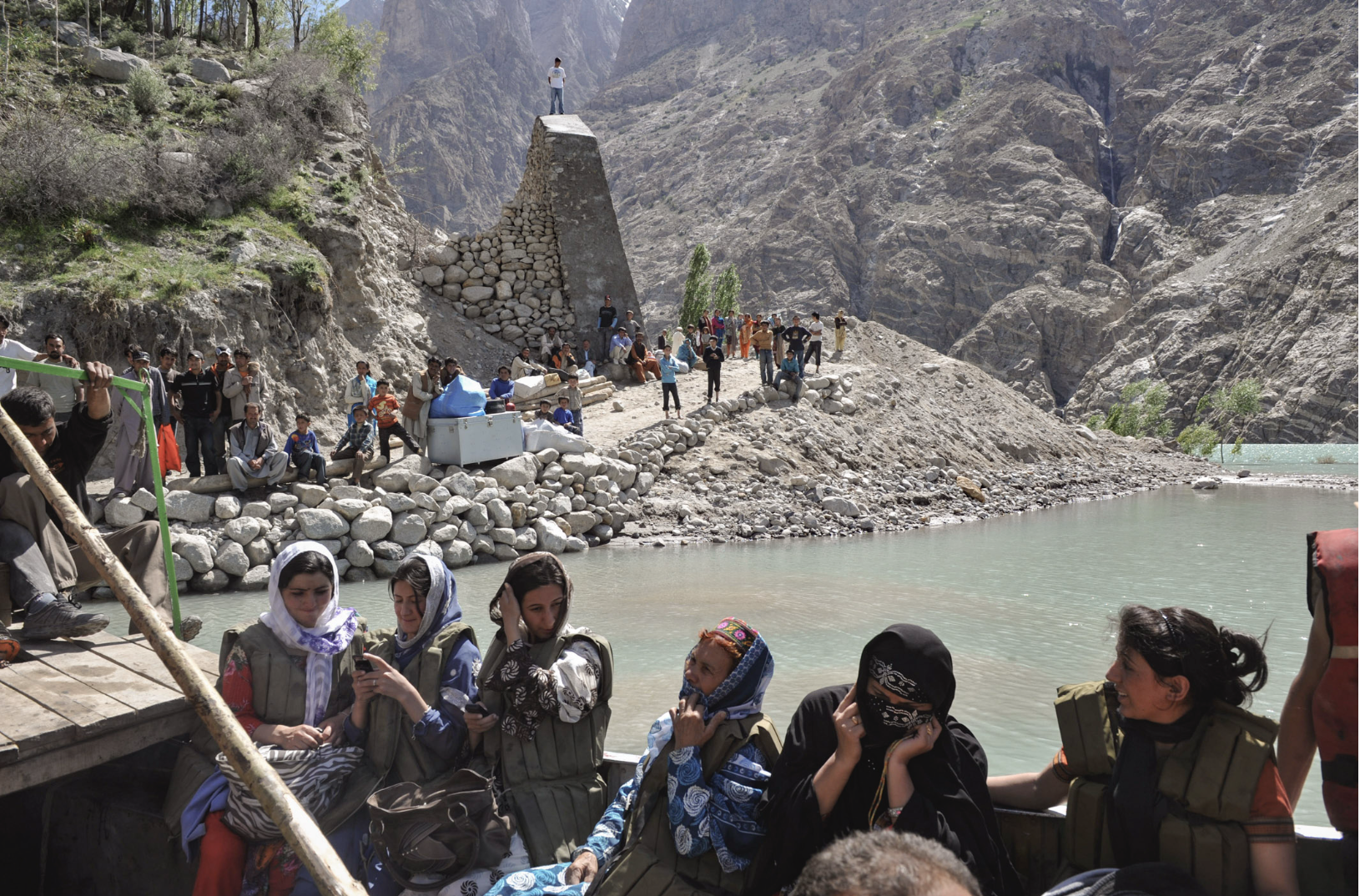   Upper Hunza, Pakistan — 2010:  A landslide dammed the Hunza River, forming Attabad Lake and cutting road access along the Karakoram Highway, forcing displaced residents to move by boat and improvised routes. (Photo/Mark Pearson) 