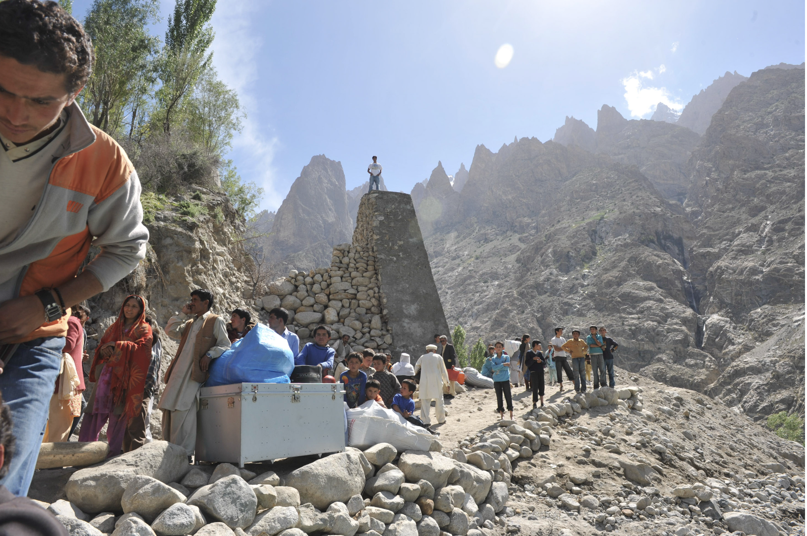   Upper Hunza, Pakistan — 2010:  A landslide dammed the Hunza River, forming Attabad Lake and cutting road access along the Karakoram Highway, forcing displaced residents to move by boat and improvised routes. (Photo/Mark Pearson) 