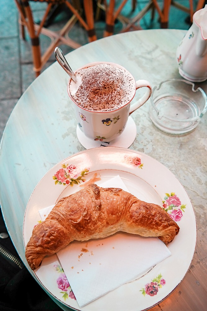 A fresh croissant and cappuccino at L'Eclair in Paris 
