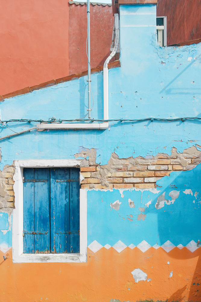 One of hundreds of colorful buildings in Burano, Italy