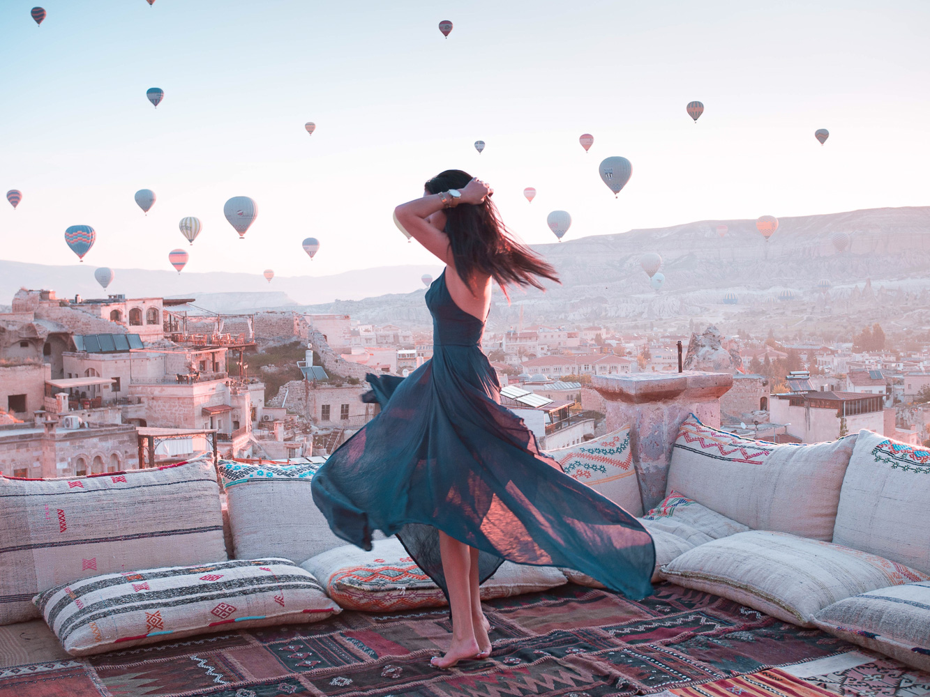 Travel influencer @theboldbrunette twirlin' around in her favorite place of all time